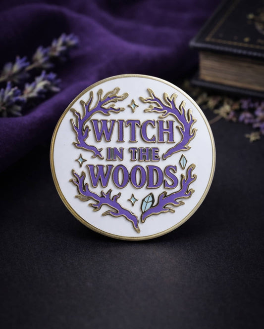 Pin with 'Witch in the Woods' text on a dark background