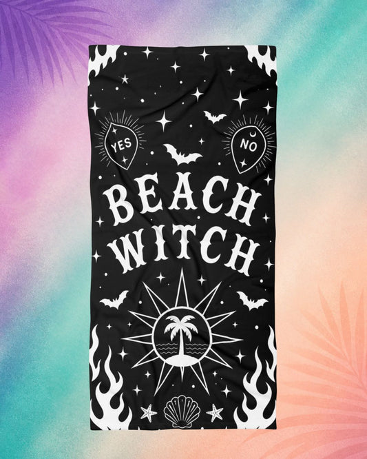 Gothic beach towel with beach witch design, black spooky beach towel with occult symbols, stars, and bats