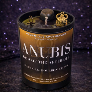 Anubis deity crystal candle inspired by the Egyptian god of protection and the afterlife, featuring dark mystical tones and crystal adornments for ritual use.