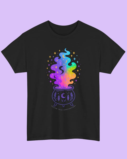 Flat lay of the black Cosmic Cauldron t-shirt showcasing the celestial cauldron design on a dark background.