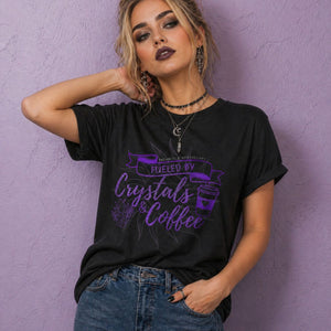 Model wearing a black crystal shirt styled as witch clothing, featuring a spiritual t shirt design with crystals and coffee graphic