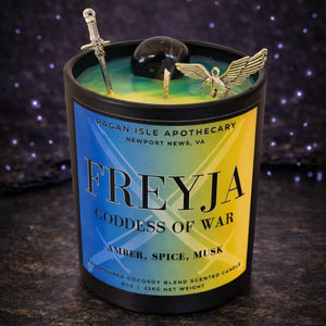 Freyja deity crystal candle inspired by the Norse goddess of love and magic, adorned with crystals and warm mystical tones for ritual and devotional use.