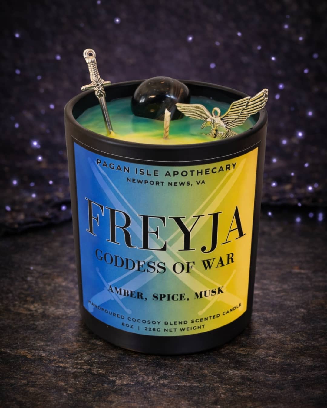 Freyja deity crystal candle inspired by the Norse goddess of love and magic, adorned with crystals and warm mystical tones for ritual and devotional use.