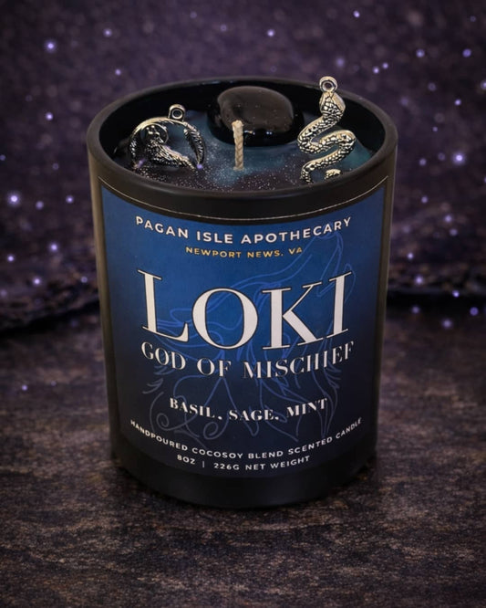 Loki deity crystal candle inspired by the Norse trickster god, featuring dynamic magical energy and crystal accents for chaos magic and transformation work.