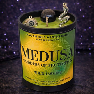 Medusa deity crystal candle symbolizing protection, rage, and reclaimed power, crafted with dark tones and crystals for shadow work and altar decor.