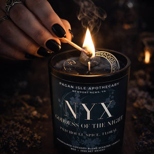 Nyx crystal candle with deep-toned crystals, crafted for shadow work, dreams, and nocturnal magic.