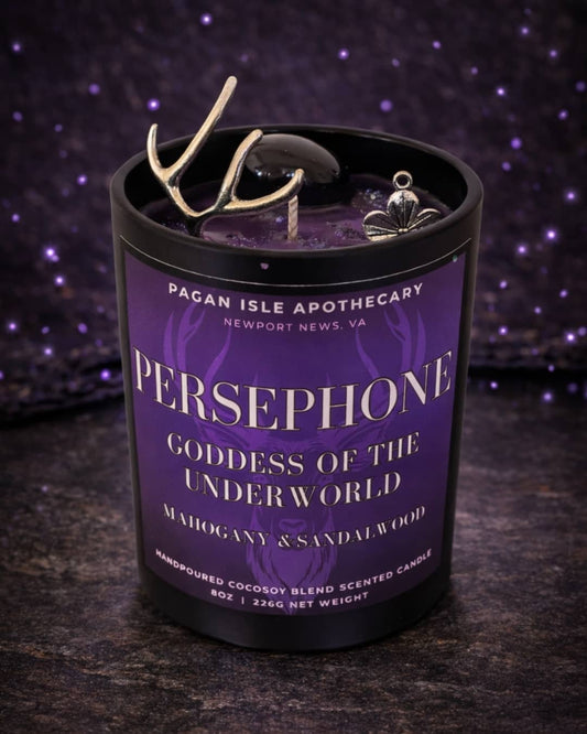 Persephone deity crystal candle symbolizing transformation, rebirth, and duality, adorned with crystals and rich tones for seasonal and shadow work rituals.