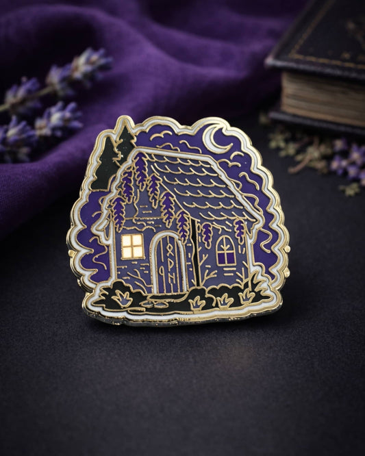 Enamel pin of a house with a purple background