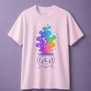Light pink witchy t shirt featuring colorful cauldron design in soft witch aesthetic clothing style