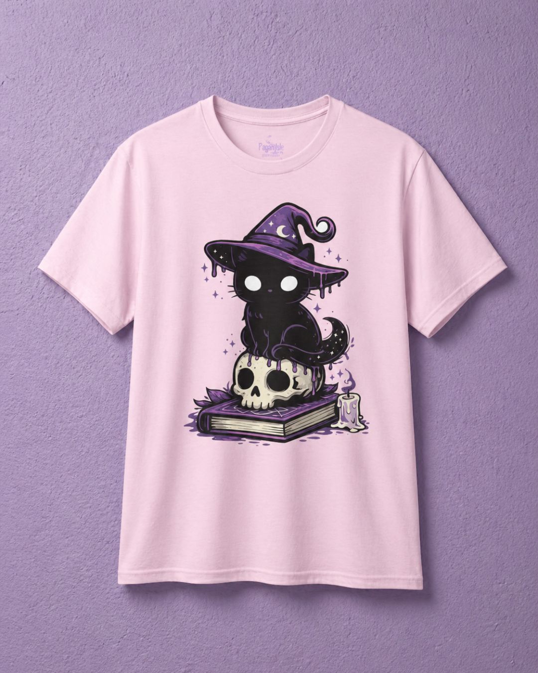Pink witchy t shirt with cute witch shirt design showing black cat sitting on skull and book