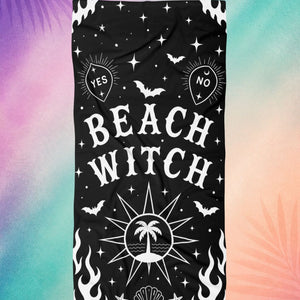 Gothic beach towel with beach witch design, black spooky beach towel with occult symbols, stars, and bats
